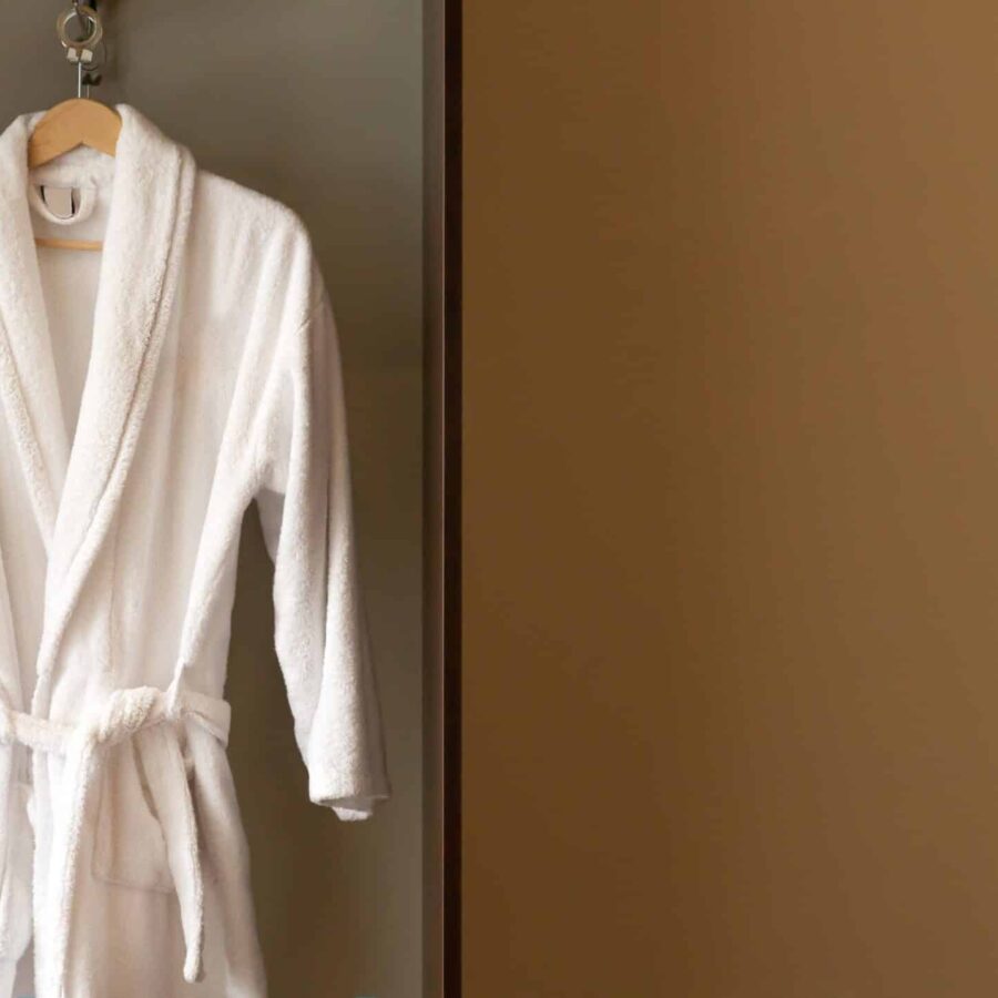 Hanger,With,Clean,White,Bathrobe,In,Hotel,Wardrobe.,Space,For