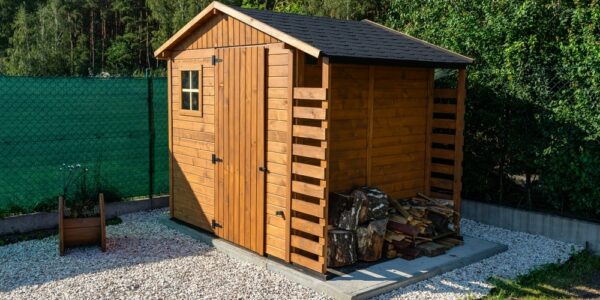 A,Wooden,Garden,Shed,Standing,On,A,Concrete,Foundation,In